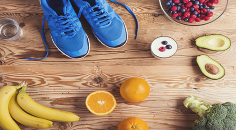 Running shoes surrounded by fruit. 