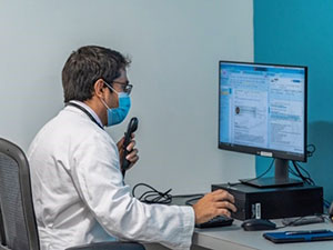 A doctor on a computer
