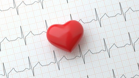red plastic heart on an EKG reading