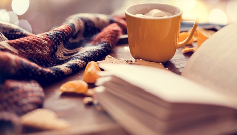 A cup of tea and a book. 