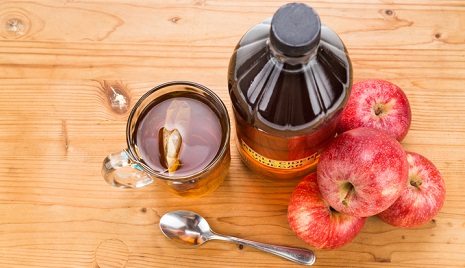 Apple cider vinegar on a table.