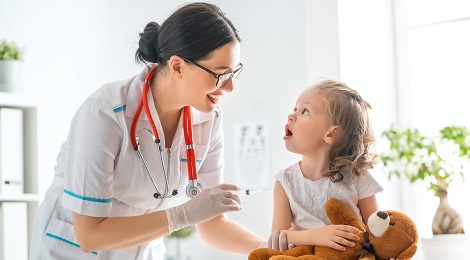 A physician and child at a routine check up.