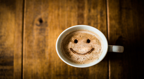 Coffee with a smiley face on top.