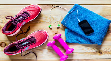 Workout shoes, iphone, weights, and towel. 
