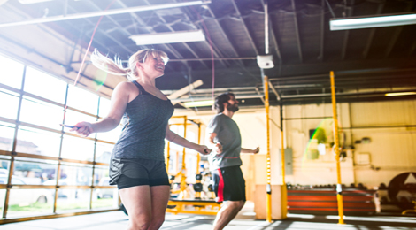 Jumping rope in a gym.