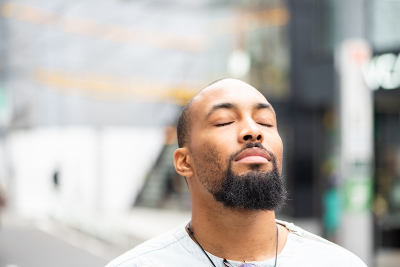 A man meditates silently. 