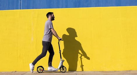 Man riding a scooter.