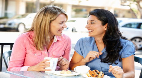 Two friends eating lunch outside.