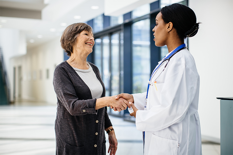 A woman speaks with her physician. 