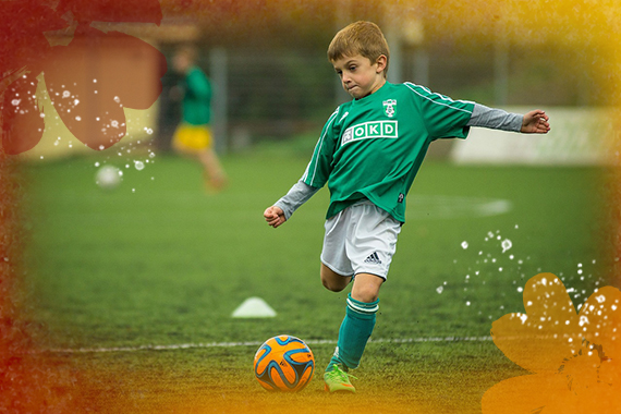 Boy kicking a soccer ball