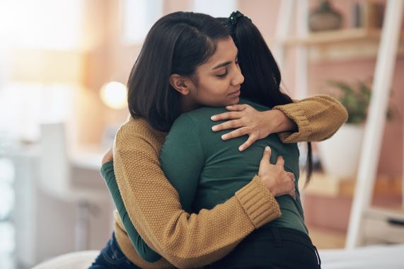 photo of two women hugging