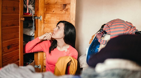 Woman organizing her closet