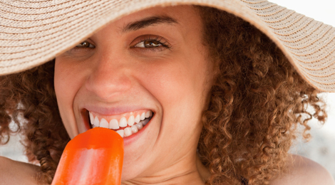 Woman eating a popsicle