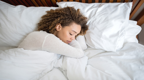 Women sleeping in her bed.