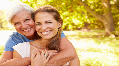 Mother and daughter hugging.