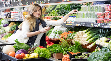 A woman staring at her heart-healthy grocery list. 