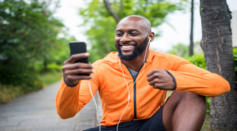 Athlete on his cell phone while on a jog.