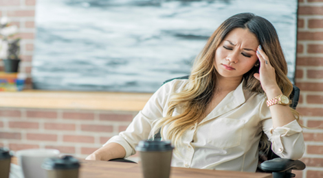 A stressed woman at work.