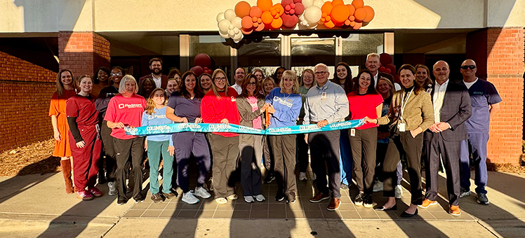 Group photo during a ribbon cutting