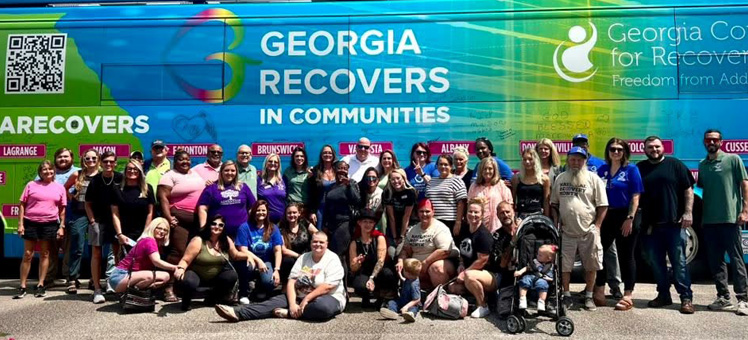 Group photo during Walton bus tour stop