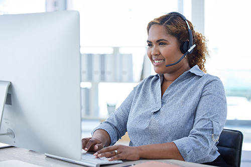 A woman sitting at a computer