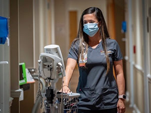 A nurse walking down a hallway