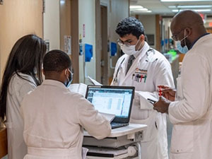 A group of doctors standing in a hallway