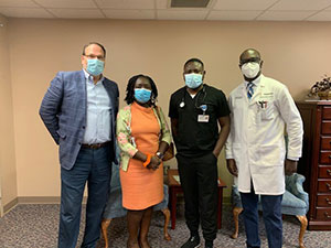 A group photo of staff wearing masks