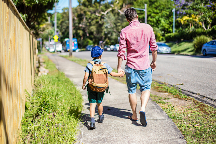 Two students wearing bookbags