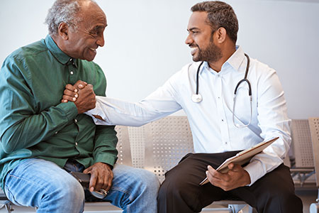 Provider and patient holding hands