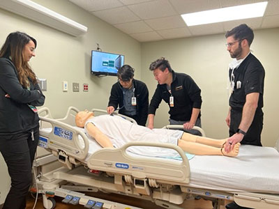 Photo of residents training in a simulation lab