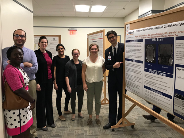 Members of the Piedmont Athens GME team standing in a hallway