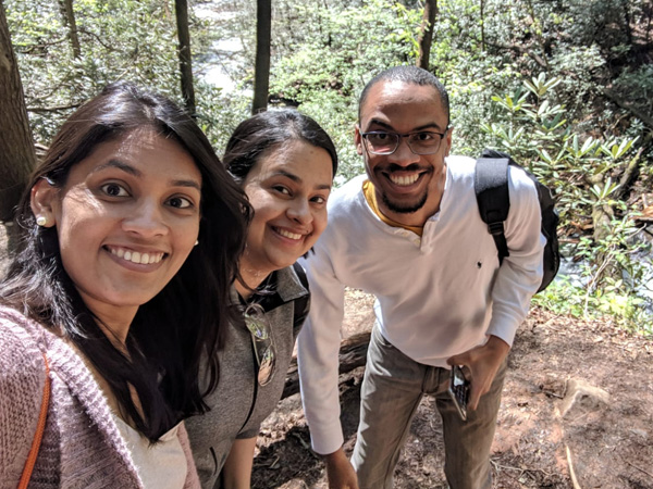 PARGME team members posing for a photo in the woods