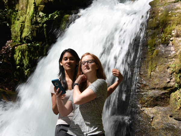 PARGME team members near a waterfall