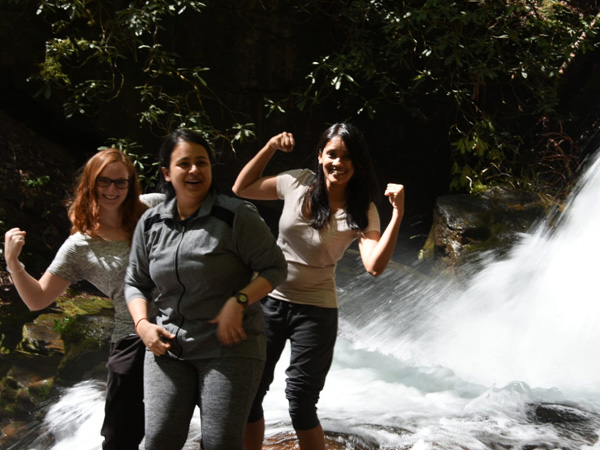 PARGME team members near a waterfall